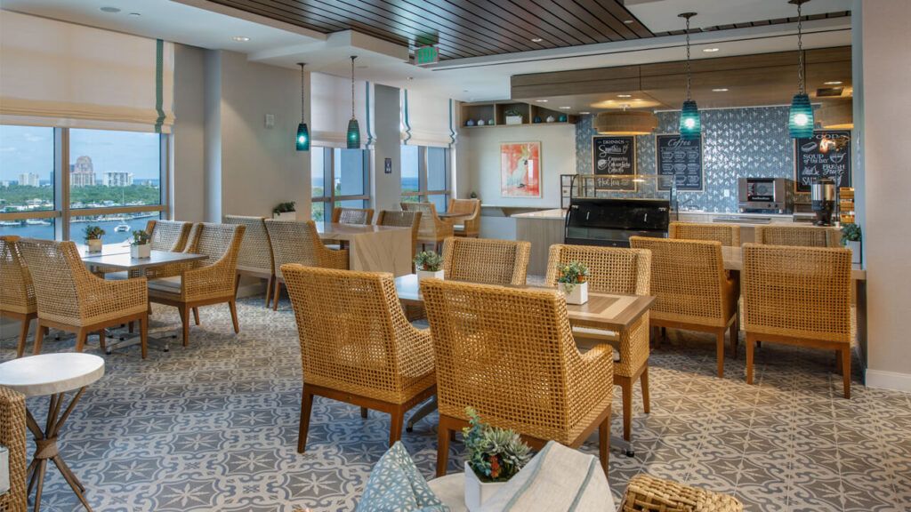A modern cafe interior with wicker seating and stylish decorations.