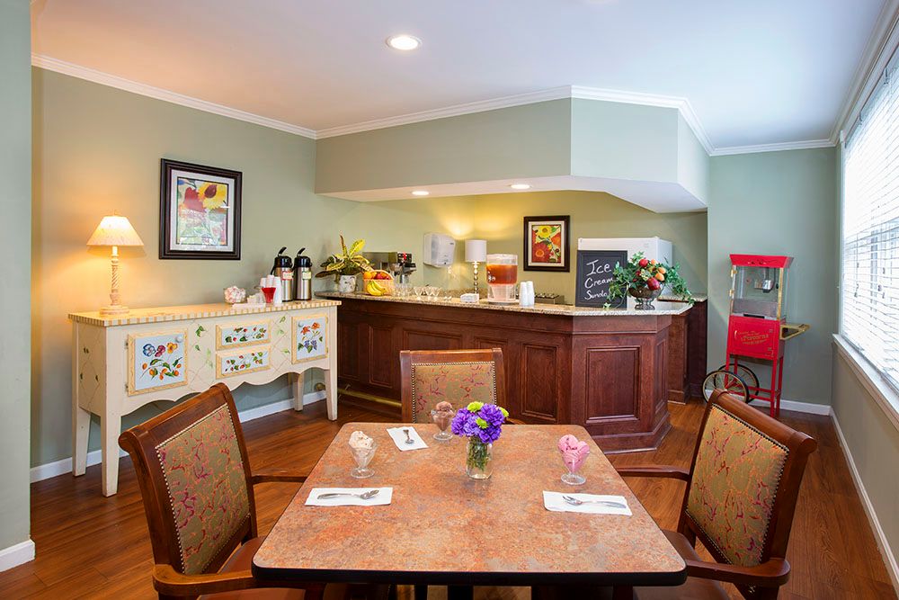 A cozy dining area featuring a breakfast setup with various food items and beverages.