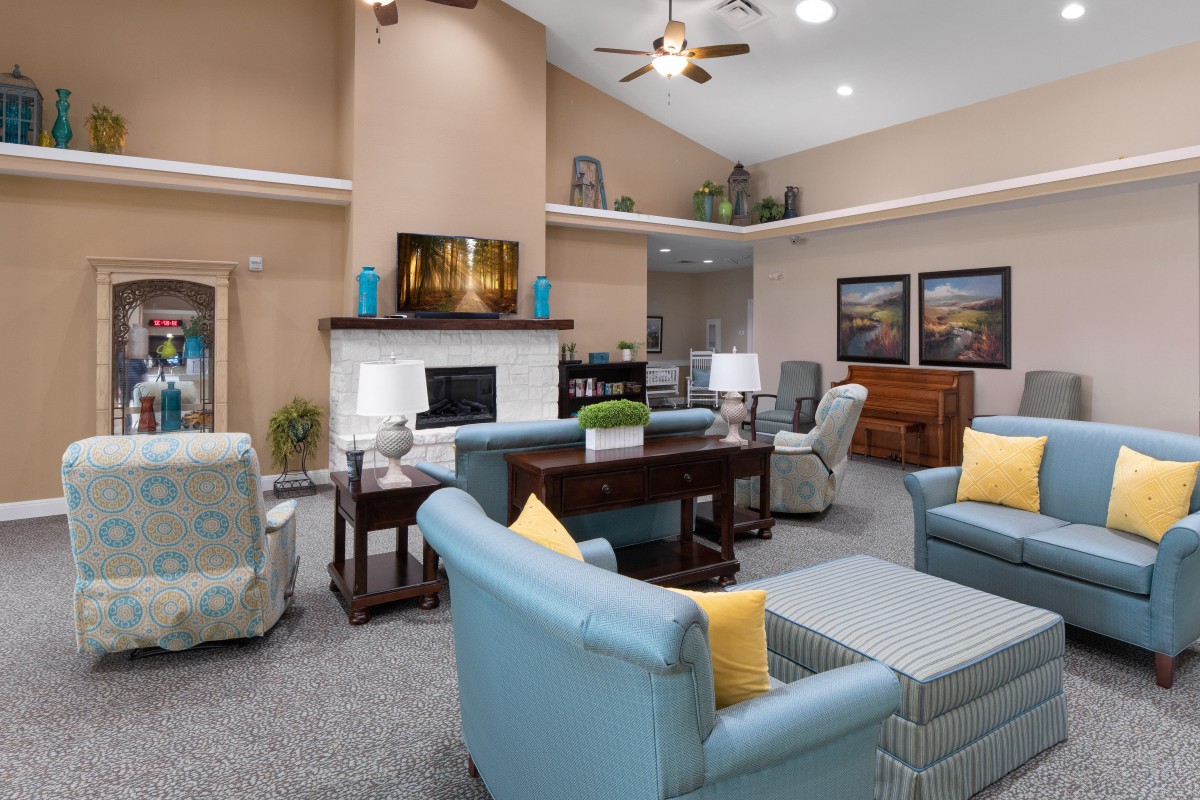 A modern and cozy living room featuring stylish furniture, a fireplace, and tasteful decor.