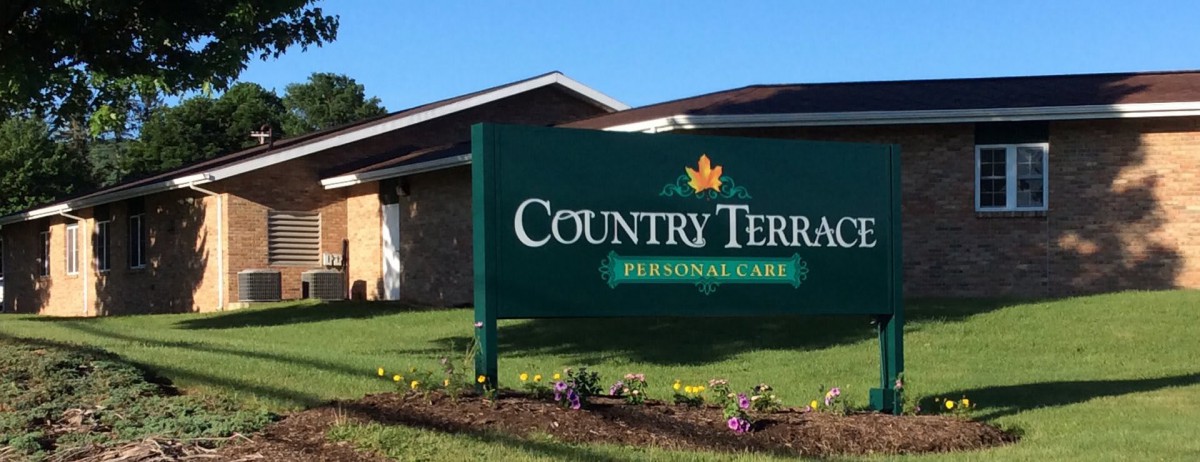 Sign for Country Terrace Personal Care in front of a building.