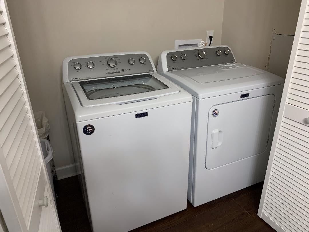 A laundry room featuring a washing machine and dryer set.