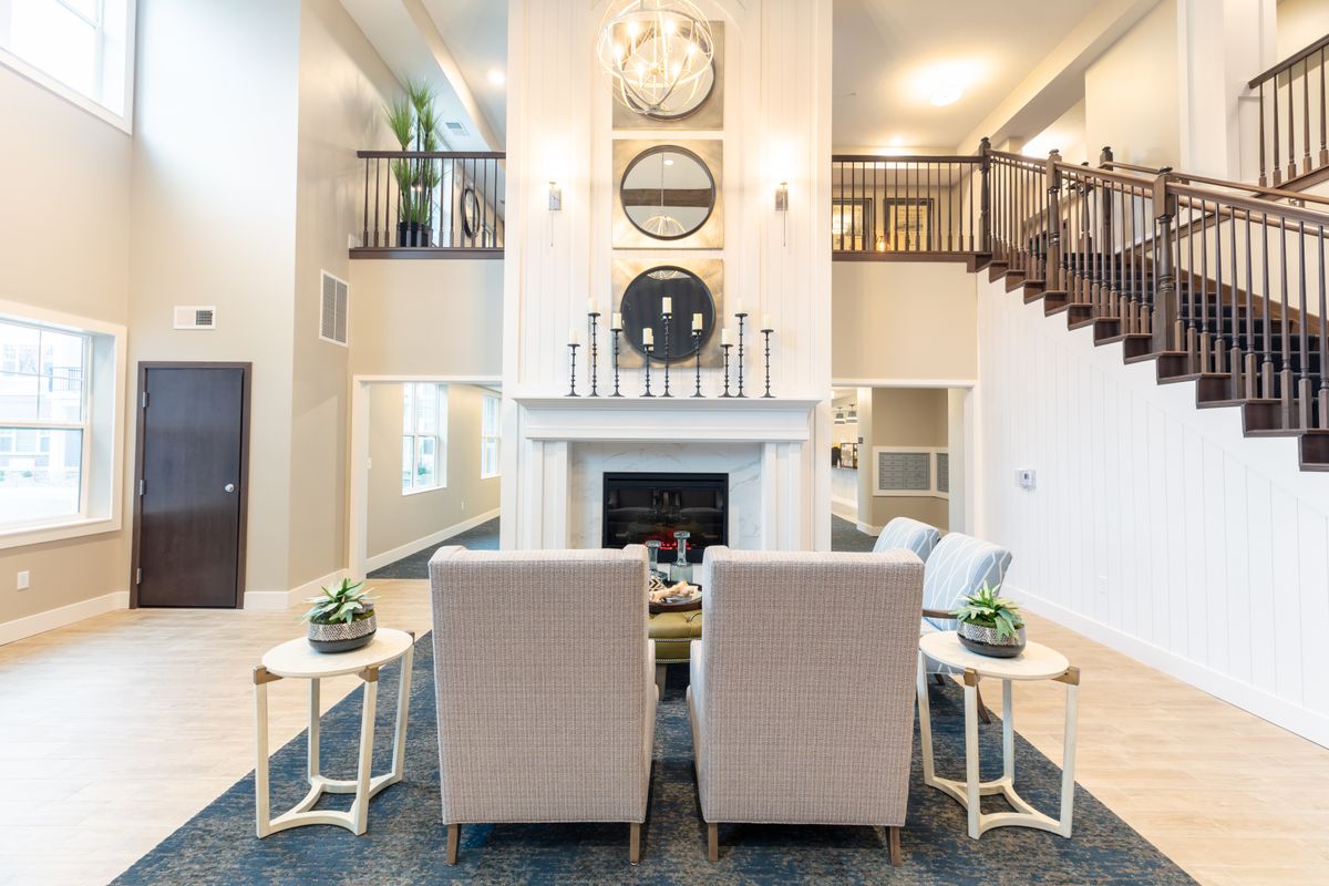 A modern living room with a fireplace and stylish decor.