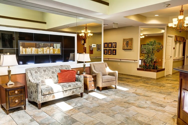 A cozy lobby area with comfortable seating and warm decor.