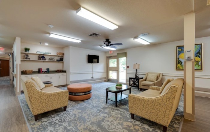 A cozy living room with comfortable seating and a television.