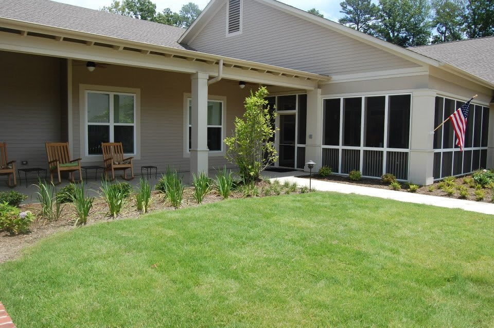 A modern house with a well-maintained lawn and garden.