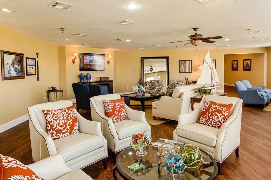 A cozy living room featuring comfortable seating and elegant decor.