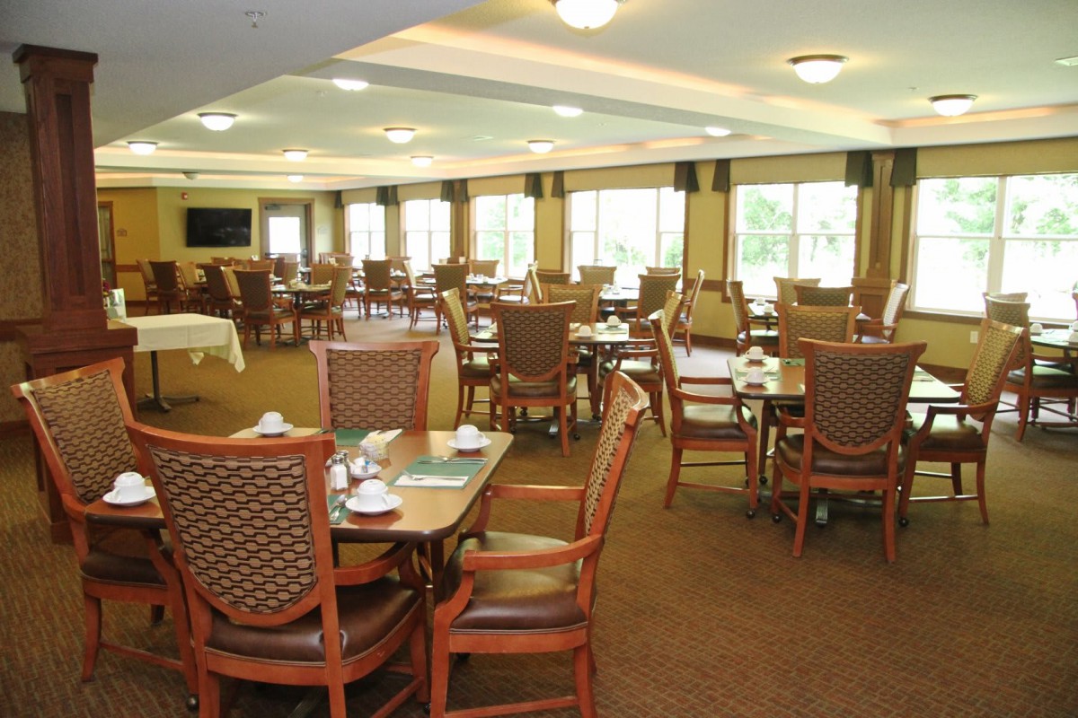 Spacious dining area with neatly arranged tables and chairs.