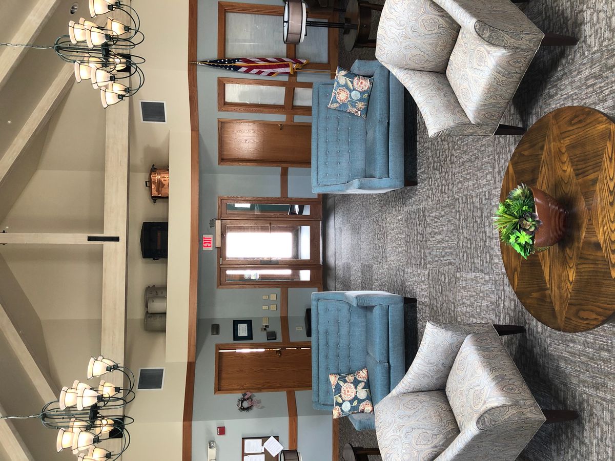 A spacious lobby with comfortable seating arrangements and tasteful decor.