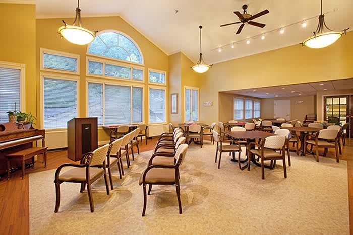 Spacious conference room with large windows and seating arrangements.