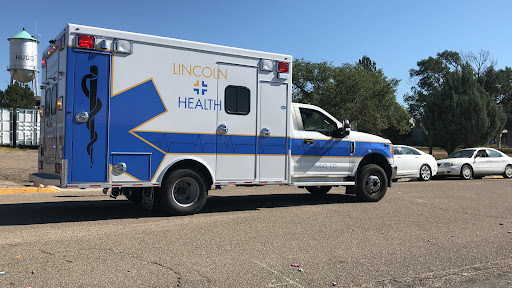 An ambulance parked, representing emergency health services.