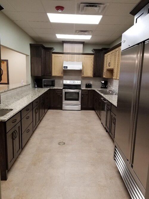 A modern kitchen with spacious countertops and stainless steel appliances.
