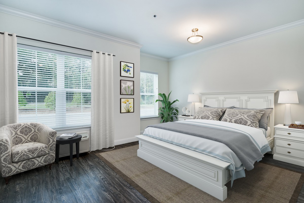 A modern and minimalist bedroom with elegant decor and a large window.