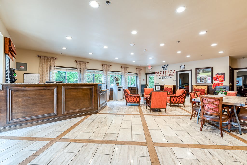 A brightly lit dining area with modern furnishings and ample seating.