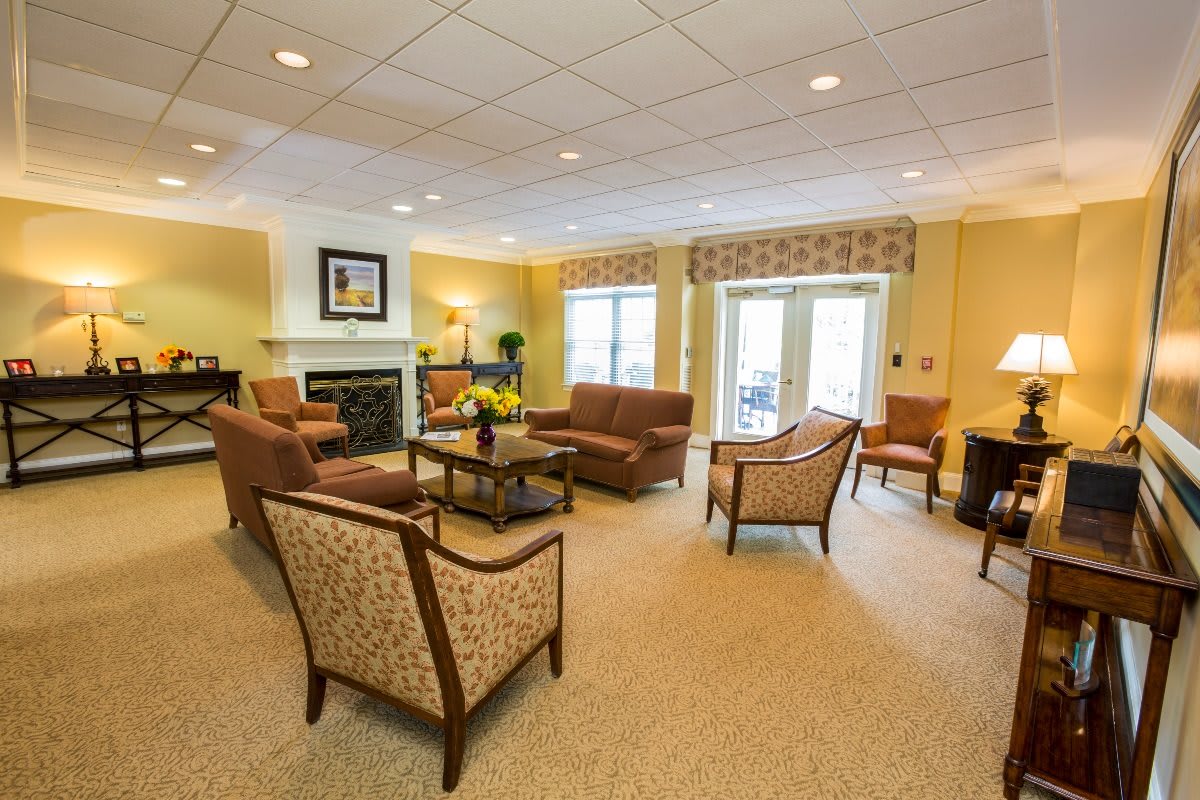 A warm and inviting living room with comfortable seating and a fireplace.