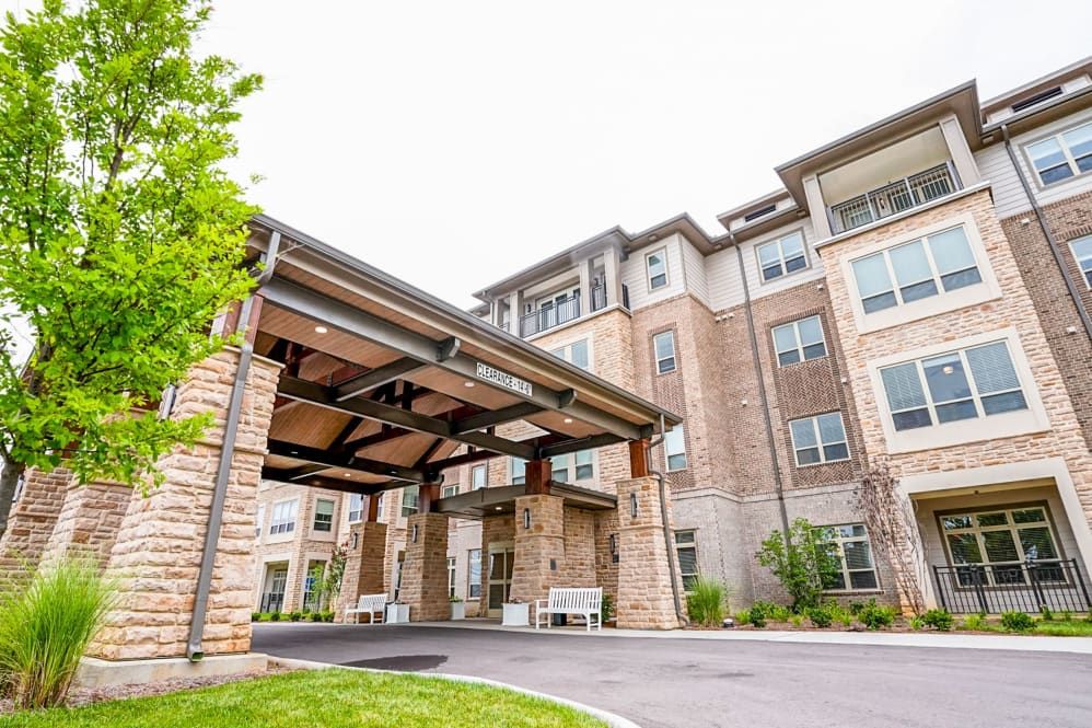 A modern residential apartment building with a covered entrance.