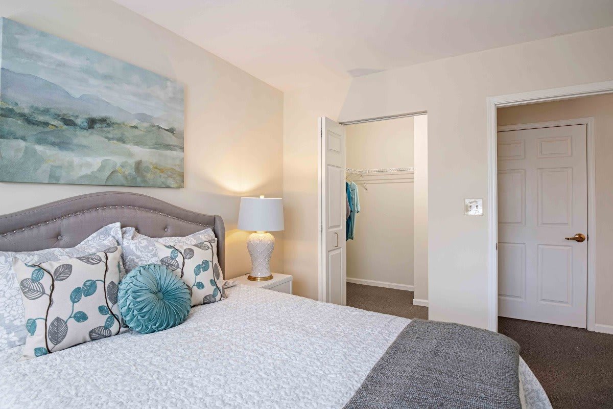 A cozy bedroom with elegant decor and soft lighting.