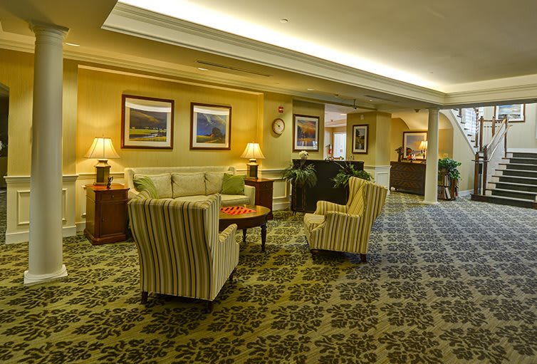 A cozy hotel lobby with comfortable seating and warm lighting.