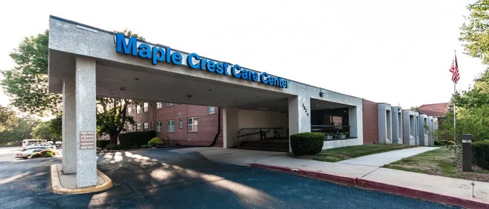 Entrance of a care center building with visible signage.