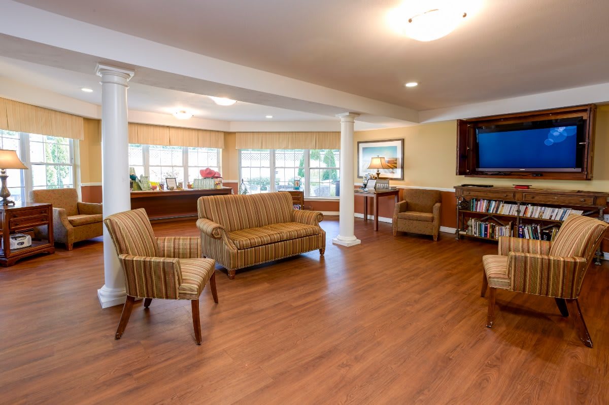 A spacious and cozy living room with comfortable seating and contemporary decor.