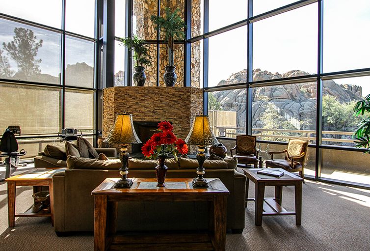 A modern lounge with large windows offering a stunning mountain view.