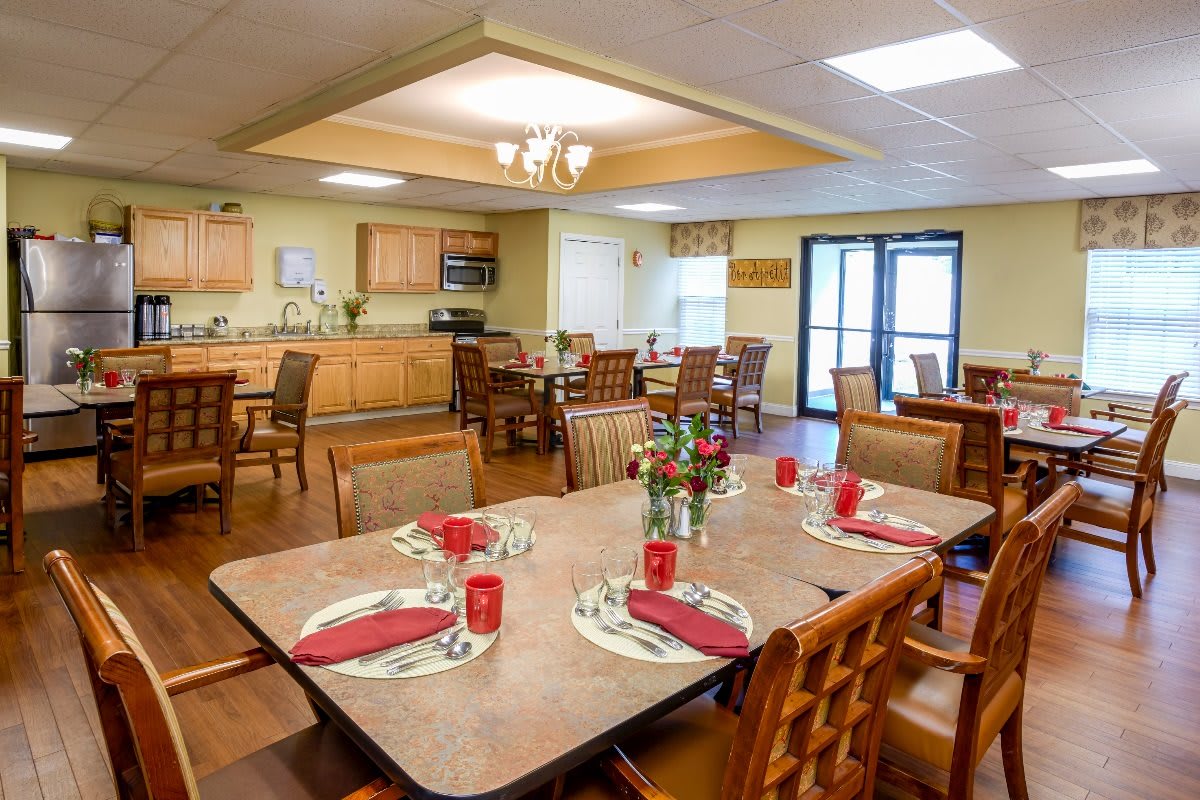 A well-decorated dining area with neatly arranged tables and chairs.