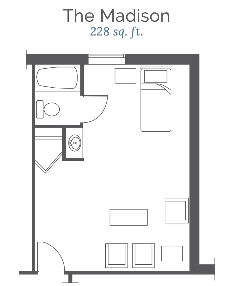A layout of a compact 228 sq. ft. studio apartment featuring a bathroom, kitchenette, and living/sleeping area.