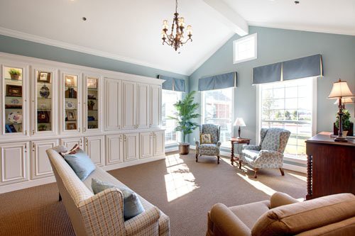 A bright and spacious living room with elegant furnishings and ample natural light.