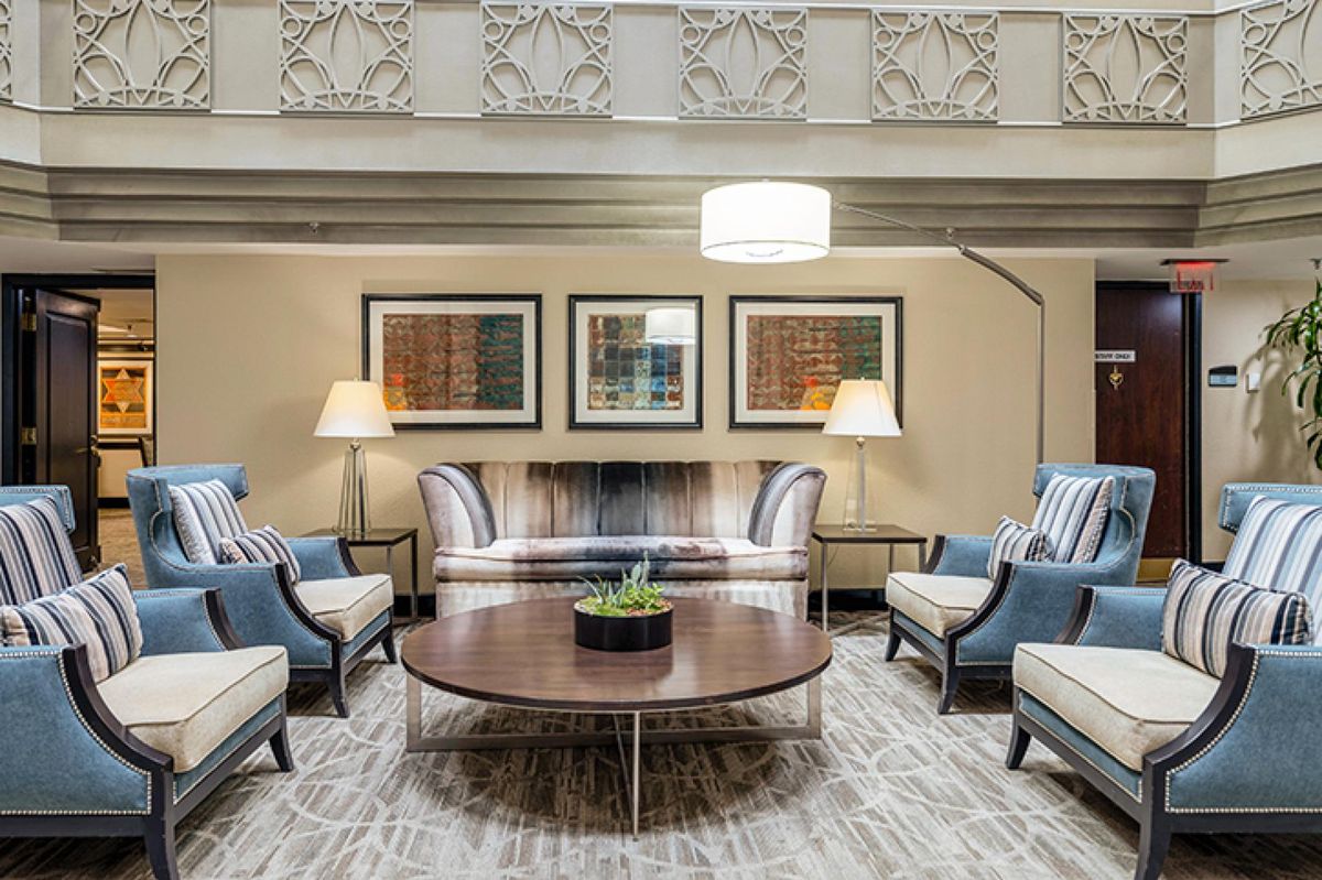 A modern living room with elegant furniture and decorative pieces.