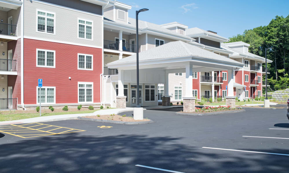 A modern apartment building with a covered entryway.