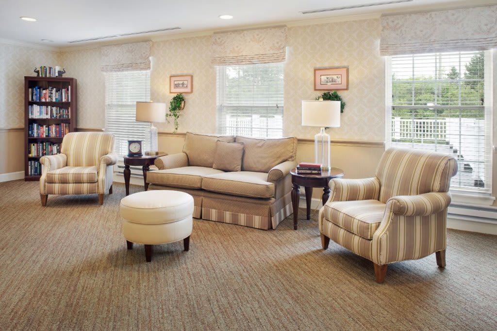 A cozy living room with comfortable seating and warm lighting.