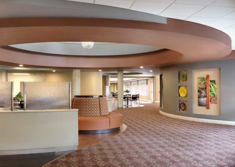 A modern lobby with stylish interior design, featuring a seating area and contemporary decor.