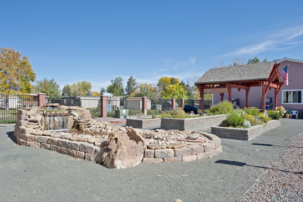 An outdoor park area featuring stone structures and garden landscapes.