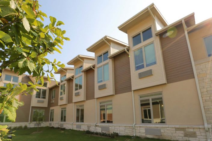 A modern building with large windows and a clean architectural design.