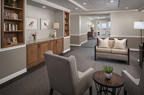 A cozy and elegantly designed living room area with comfortable seating and tasteful decor.
