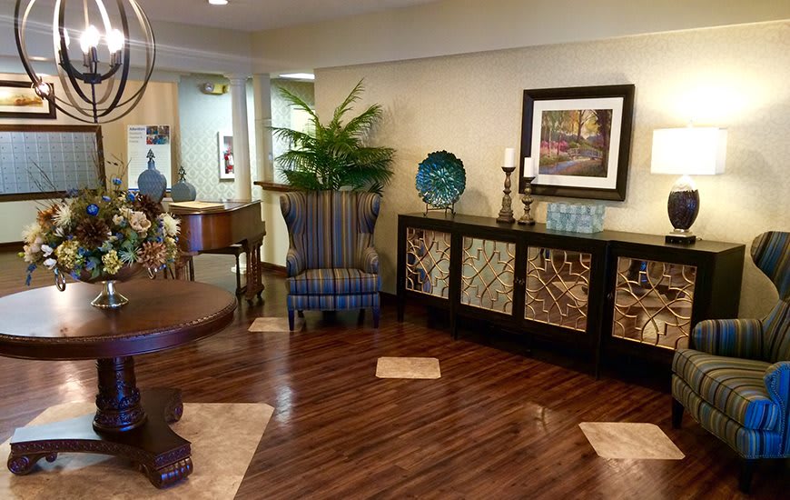 A cozy living room with elegant decor and hardwood flooring.