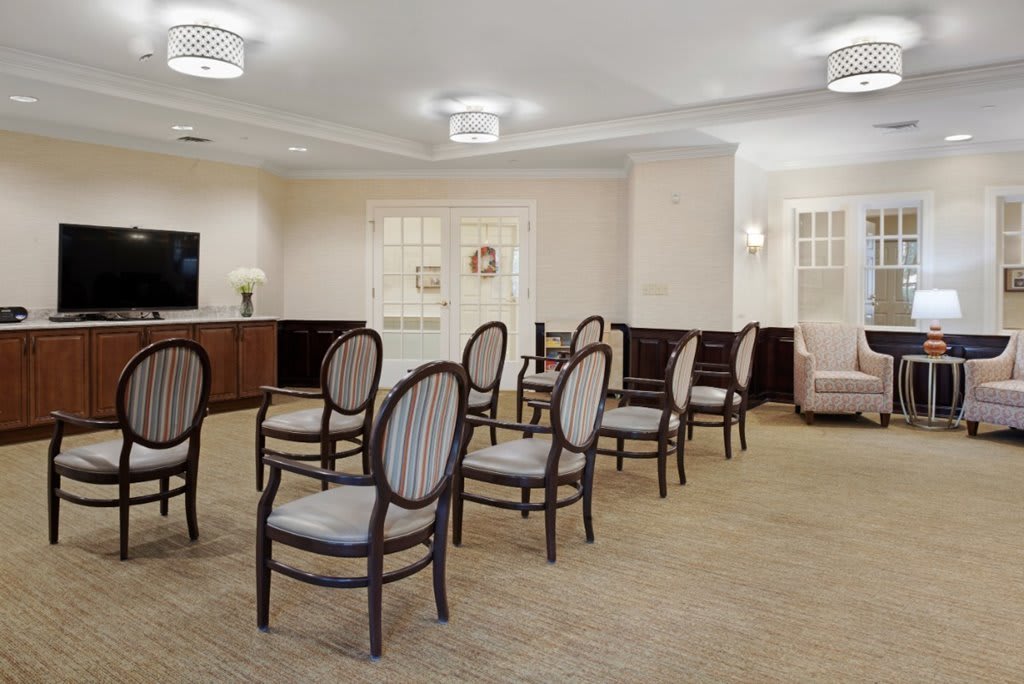 A neatly arranged room with chairs set up for a meeting or event.