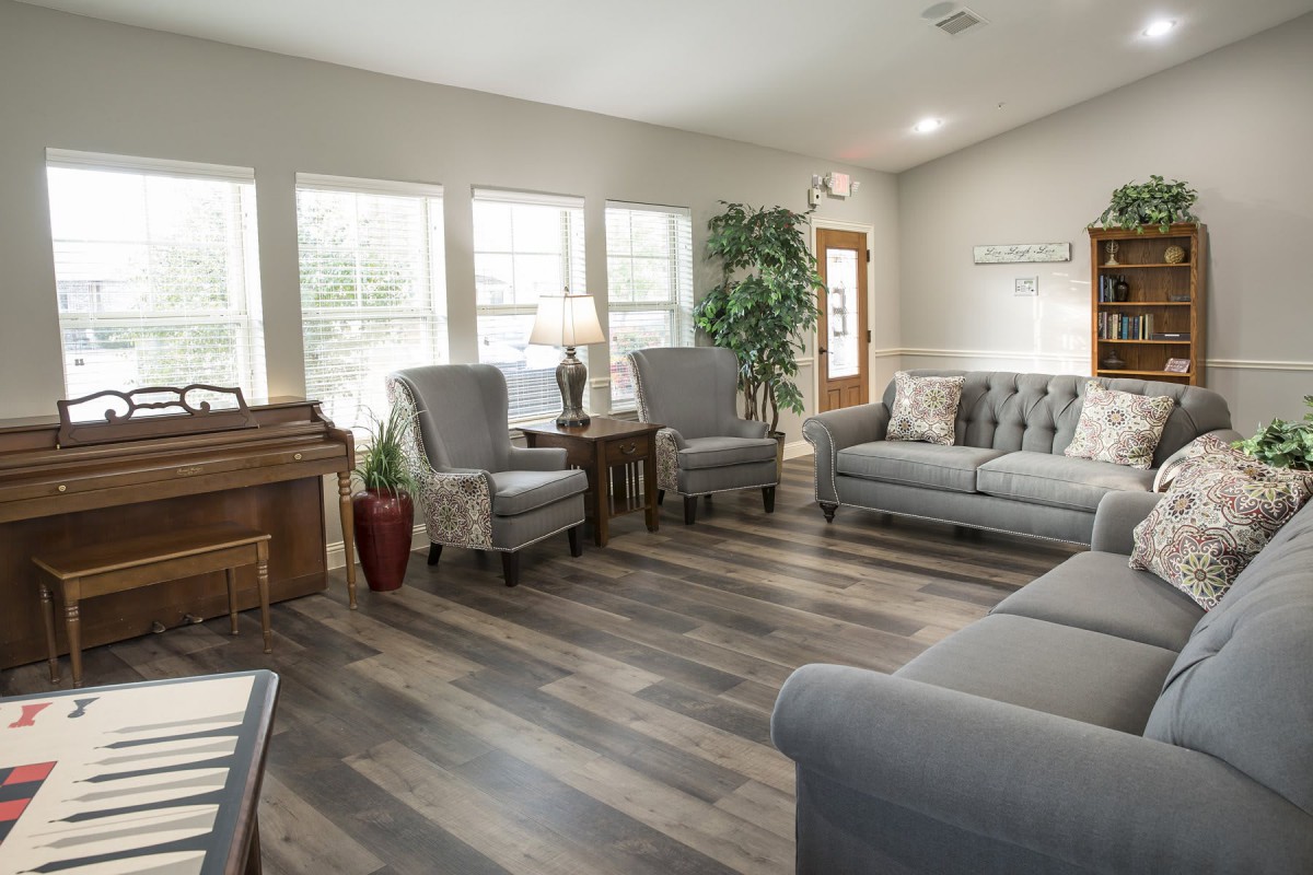 A cozy and modern living room with comfortable seating and natural light.