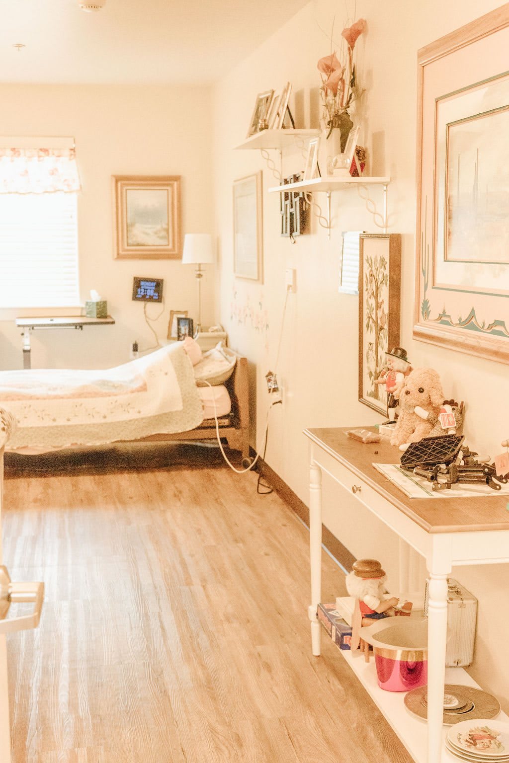 A cozy bedroom with vintage decor and warm lighting.