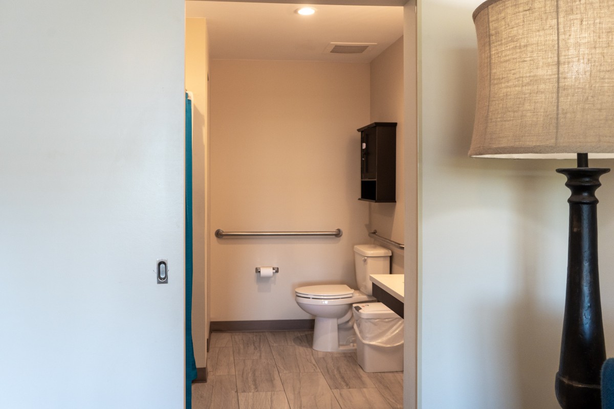 A modern restroom with a toilet and sink.