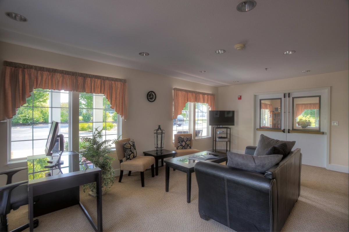 Cozy living room with comfortable seating and natural light.