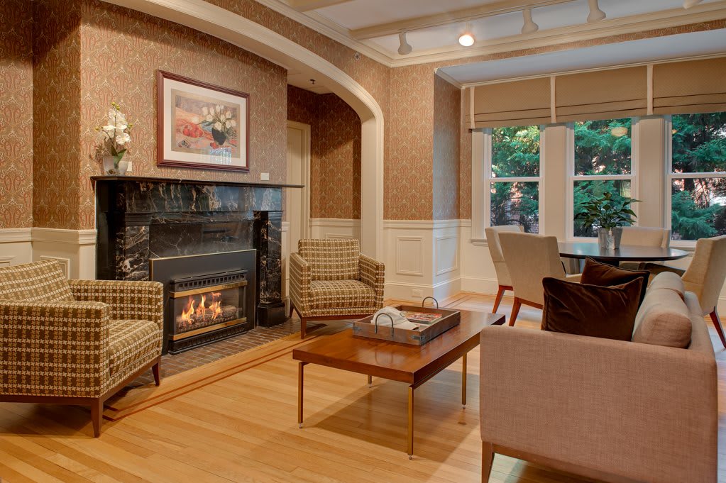 A cozy living room with a fireplace and comfortable seating arrangement.