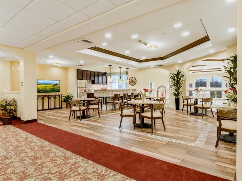 Spacious and elegantly decorated dining area with modern furnishings.