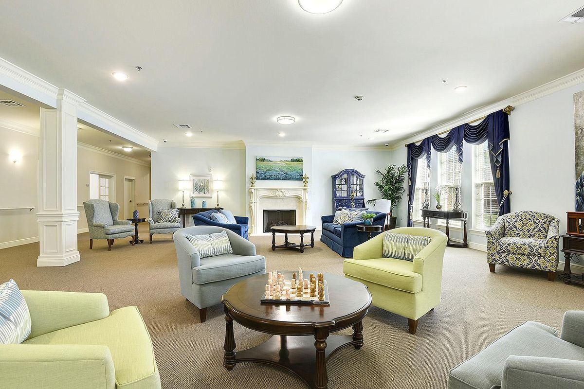 A cozy living room with comfortable seating and a fireplace.