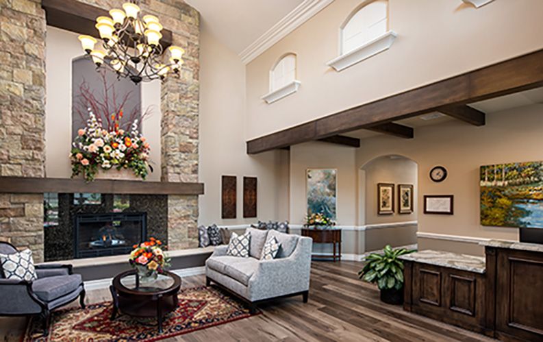 Elegant living room with a stone fireplace and stylish decor.