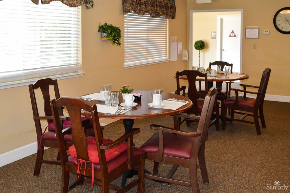 A cozy dining area with neatly arranged tables and chairs, perfect for enjoying a meal indoors.