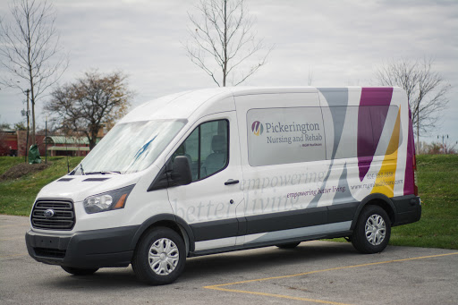 A commercial van parked with branding on the side.