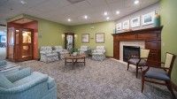 A cozy living room with comfortable seating and a fireplace.
