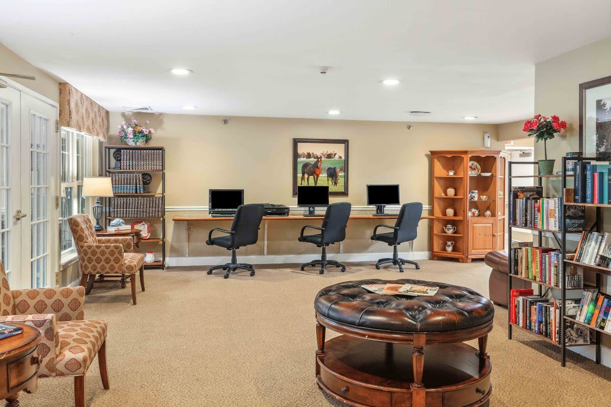 A cozy office space with multiple computer workstations and comfortable seating.