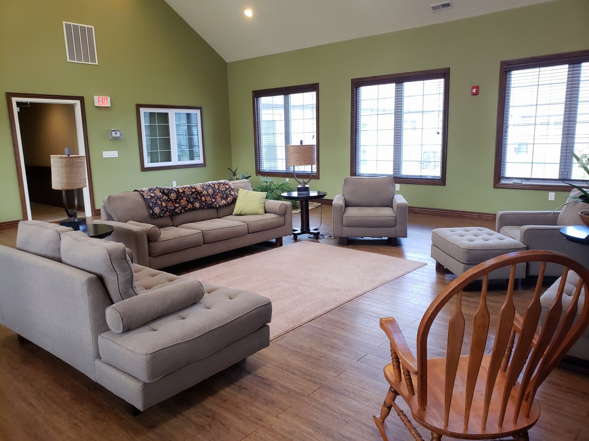 A cozy living room with comfortable seating and natural lighting.