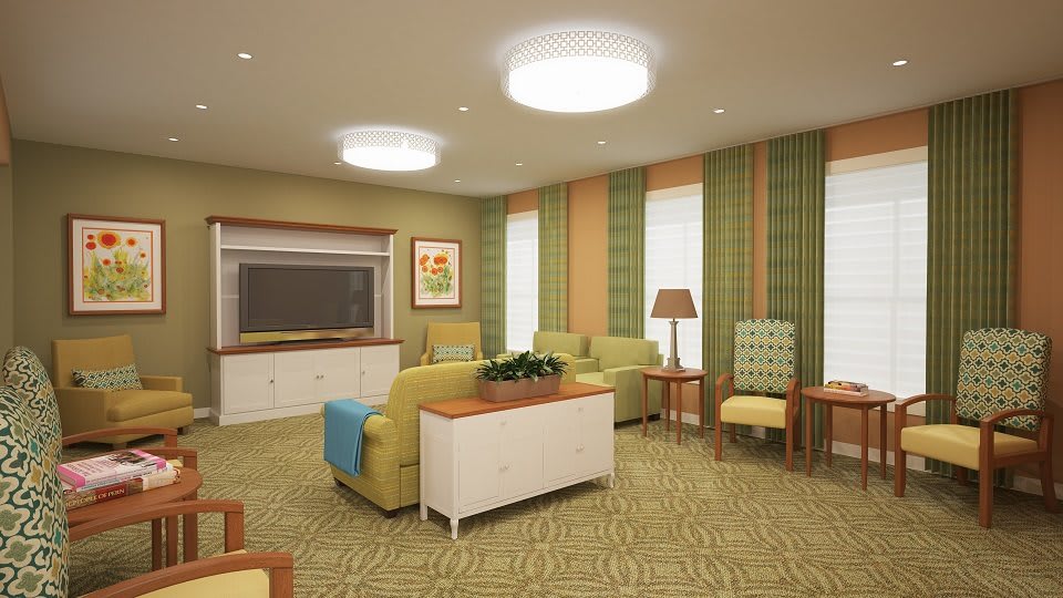 A modern living room with comfortable seating and warm lighting.